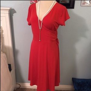 Wrap knit dress burnt orange in color